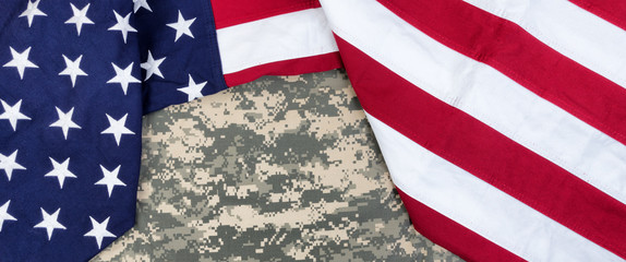 Cloth United States flag with military uniform in overhead view