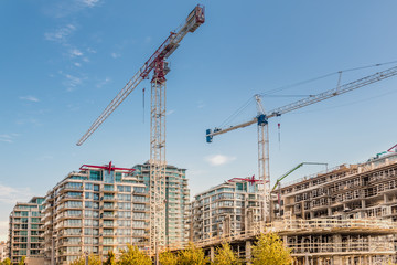 tower crane and construction between houses