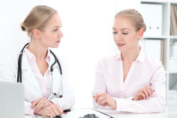 Fototapeta premium Doctor and patient during personal consulting in hospital