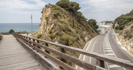 Road between Calella and Sant Pol de Mar and wooden bridge,comarca Maresme, Catalonia, Spain.