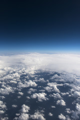 Fototapeta na wymiar Beautiful view from window of airplane in blue sky