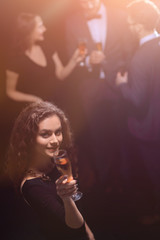 stylish young woman with glass of champagne