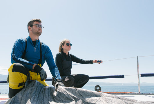 Crew on a racing sailboat or yacht