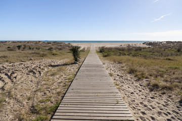 Wooden boardwalk to beach of Castelldefels, province Barcelona,Catalonia.