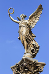 Obraz premium The gold Angel in front of House of Artists, Prague, Czech Republic