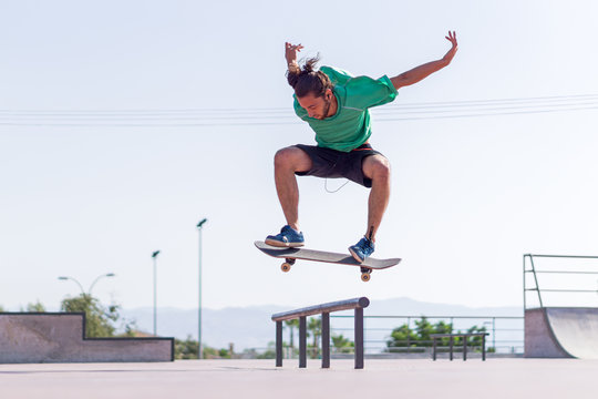 Skateboarder practising his skills in Skate Park