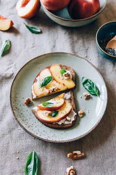 Peach toast with walnuts and basil