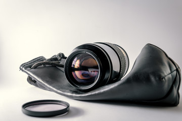 Close-up shot of photo lens on a white background.camera accessories, photographer concept design