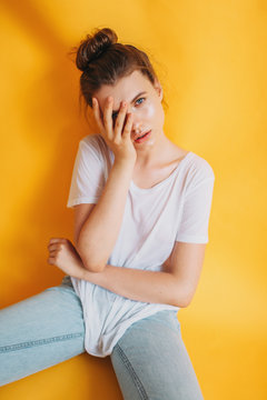 Portrait of teen model on yellow background