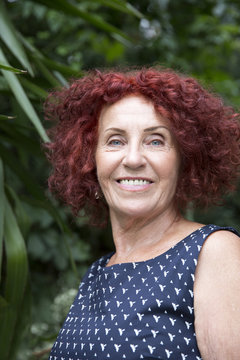 Portrait of a youthful 70 years old redhead woman
