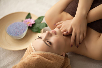 Obraz na płótnie Canvas Spa. Woman enjoying anti-aging facial massage