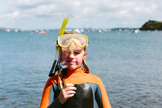 Preteen girl in a snorkel and mask