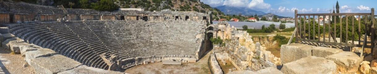 Fototapeta na wymiar Landscape, panorama, banner - view of building the theater in the ruins of ancient lycian town of Myra. The city of Demre, Antalya Province, Turkey.