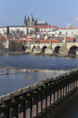 Obraz premium Early Spring Prague gothic Castle and Charles Bridge with the Lesser Town in the sunny Day, Czech Republic