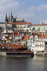 Early Spring Prague gothic Castle with the Lesser Town above River Vltava in the sunny Day, Czech Republic