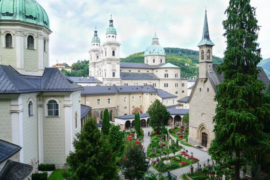 View through window to buildings and church dome from catacombs in Salzburg