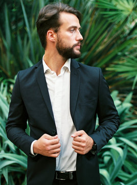 Elegant man in suit on nature