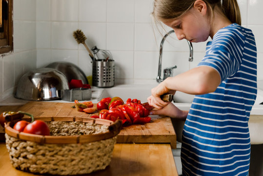 young girl with fresh tomatoes from the garden