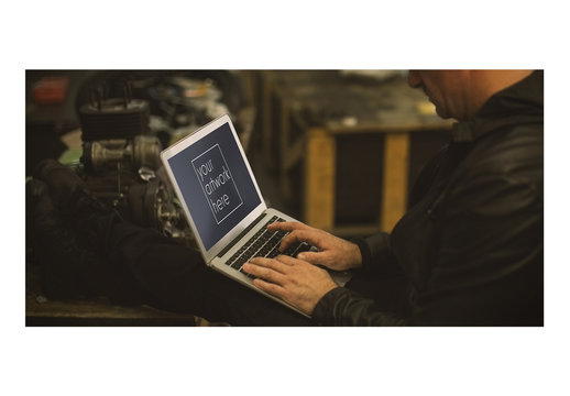 Mechanic Using Laptop Mockup 1