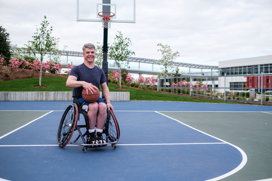 Active Disabled Athlete Practicing Wheelchair Basketball