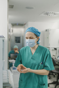 Woman holding fluid samples