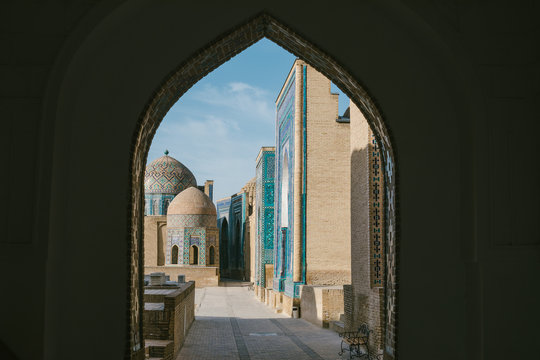 uzbek shah-i-zinda necropolis seen through an arch, samarqand, uzbeksitan