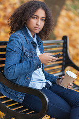 Sad Depressed Mixed Race African American Teenager Using Cell Phone