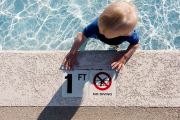 toddler in a one foot deep baby pool