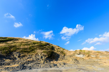 Fototapeta na wymiar 青空の城ヶ島　Hills and blue sky