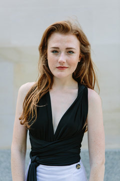 Attractive red haired woman with pale skin and freckles