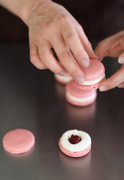 Confectioner making macaroons