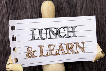 Word, writing, text  Lunch And Learn. Conceptual photo Presentation Training Board Course written on torn paper holding by sculptureon the wooden background
