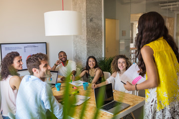 Business people at staff meeting.
