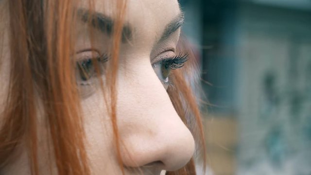 Sad pensive intense look of young woman-outdoor