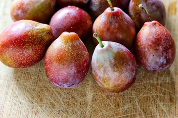 Fresh Sugar Plum On Wooden Cutting Board