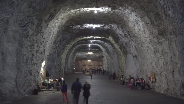 Tourists walking in saline underground mine, looking for healthy recreation