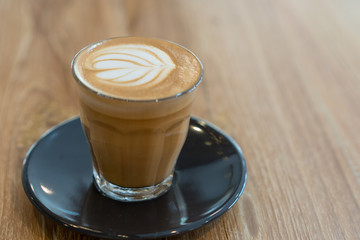 Hot coffee cup on wooden table