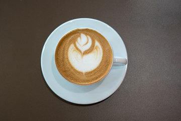 Hot coffee cup on wooden table