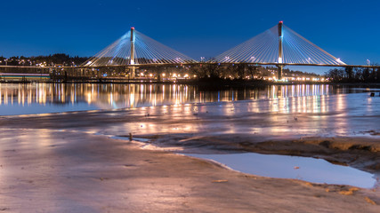 Fototapeta na wymiar Port Mann Bridge, long exposure in a bright night. Vancouver, British Columbia, Canada.