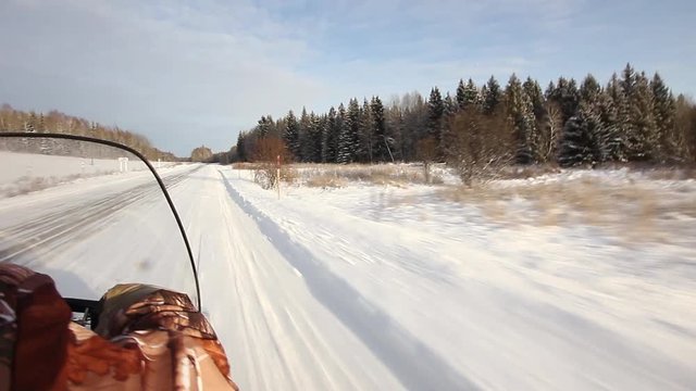 Snowmobile is off-road in the taiga