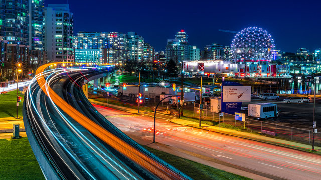 Long exposure of downtown Vancouver, British Columbia, Canada. One of the most vibrant city in North America. Sky train lights trail, stars and glitters.