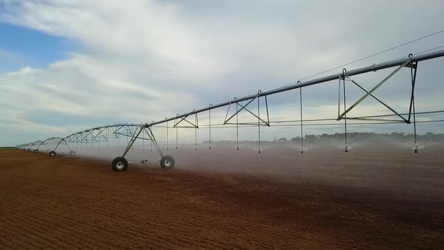 Pivot irrigation used to water plants on a farm. Circling pivot irrigation with drone