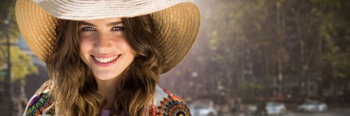 Composite image of beautiful woman with a straw hat 