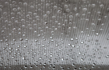 Abstract texture of translucent polycarbonate with water drops
