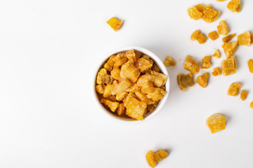 Fried crispy pork skin in white bowl top view on white background
