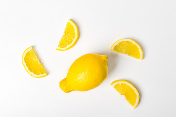 Fresh yellow lemon fruit and lemon slice on white background