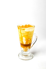 Desserts, A cup of yogurt and orange sauce with beans on white background