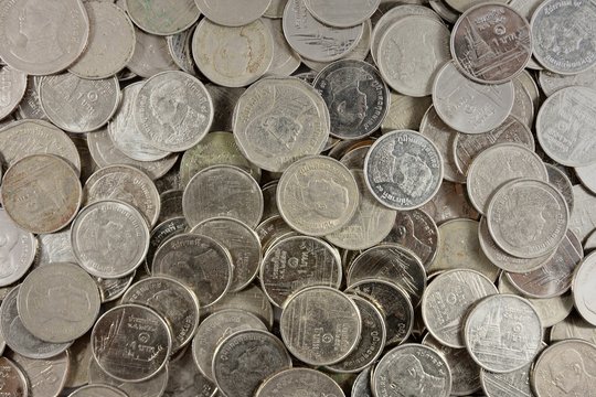 The silver coins stack several coins