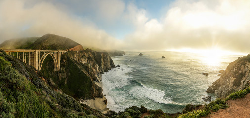 A sweeping panoramic view of Bixby bridge, along the Big Sur coast in northern California.