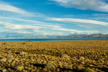 Vast plains on a partially cloudy day in Patagonia, Argentina. Motion blur applied